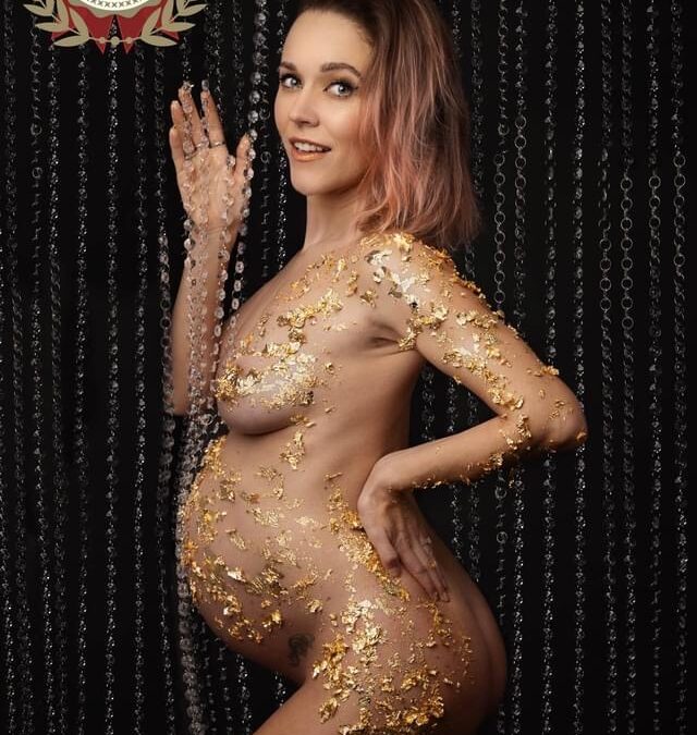 Pregnant Momma to be covered in gold foil surrounded by chains, taken by maternity photographer Sutton Coldfield birmingham